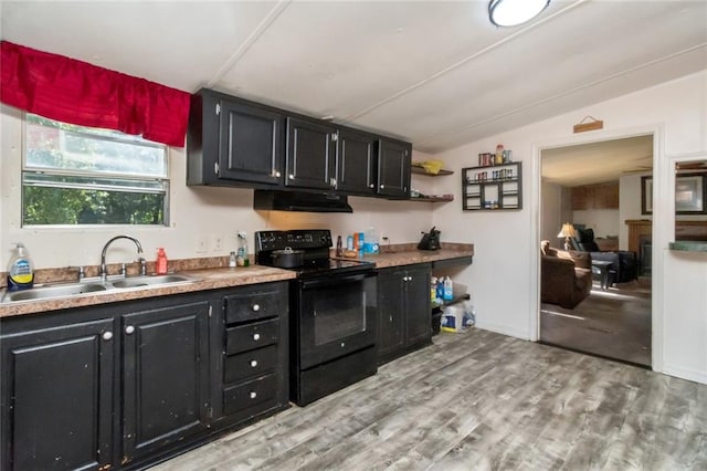 kitchen with sink, light hardwood / wood-style flooring, black electric range oven, and lofted ceiling