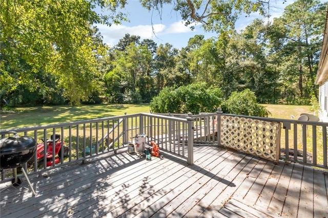 deck with a lawn and a grill