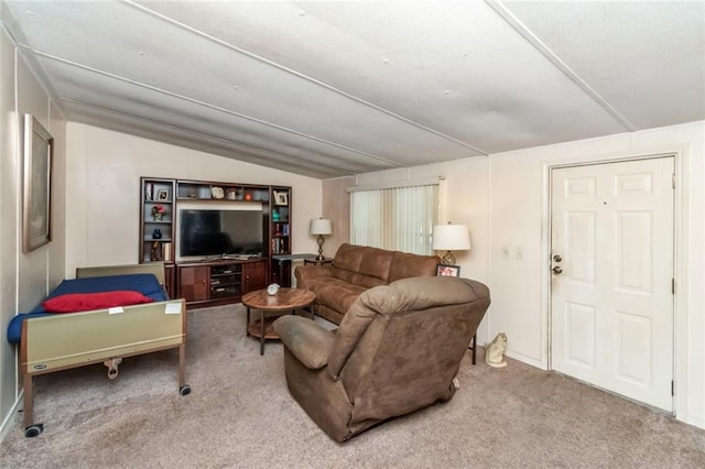 living room featuring lofted ceiling and carpet flooring