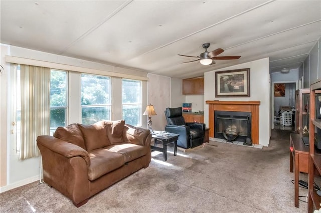 living room with light colored carpet and ceiling fan