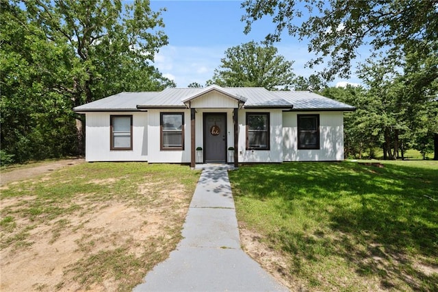 19960 Boothe Dr, Citronelle, AL 36522 - view of front of home with a front lawn and a metal roof
