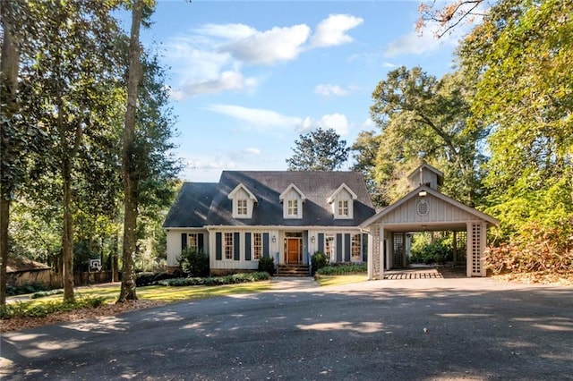 cape cod house featuring covered porch