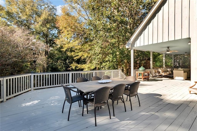 wooden terrace featuring ceiling fan and an outdoor hangout area