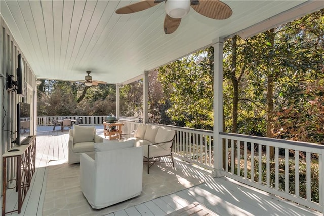 deck featuring an outdoor living space and ceiling fan