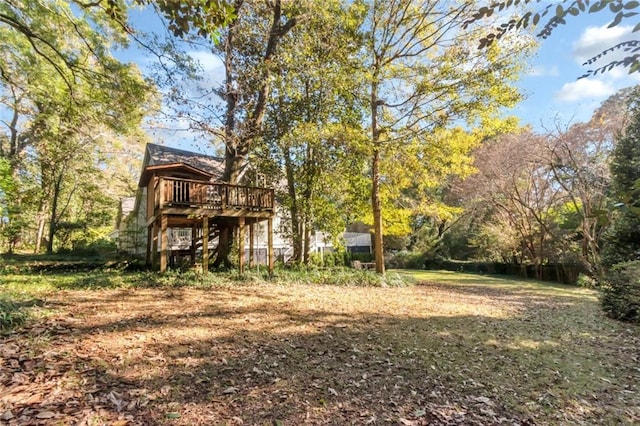 view of yard featuring a wooden deck