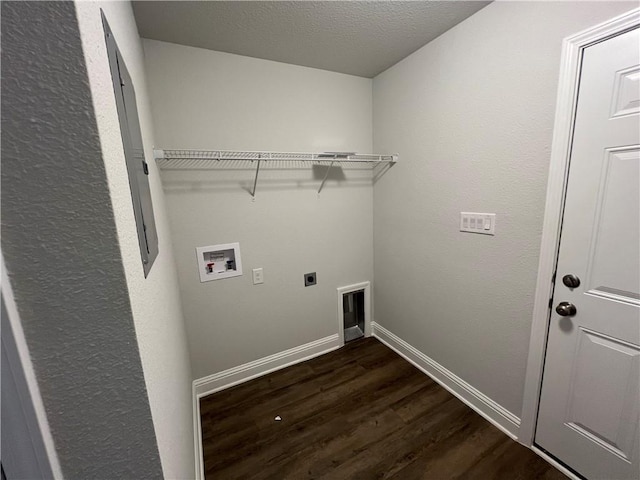 clothes washing area featuring electric dryer hookup, a textured ceiling, hookup for a washing machine, and dark hardwood / wood-style flooring