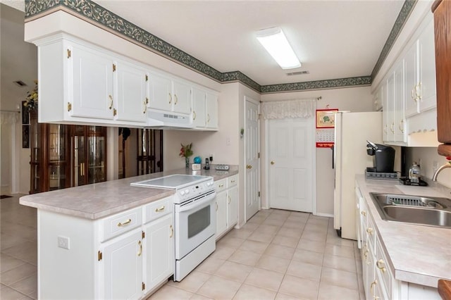 kitchen featuring light tile patterned floors, sink, white range with electric stovetop, and white cabinetry