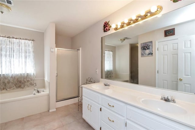 bathroom featuring vanity, tile patterned flooring, and plus walk in shower