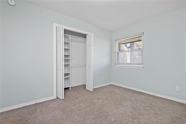 unfurnished bedroom featuring carpet flooring