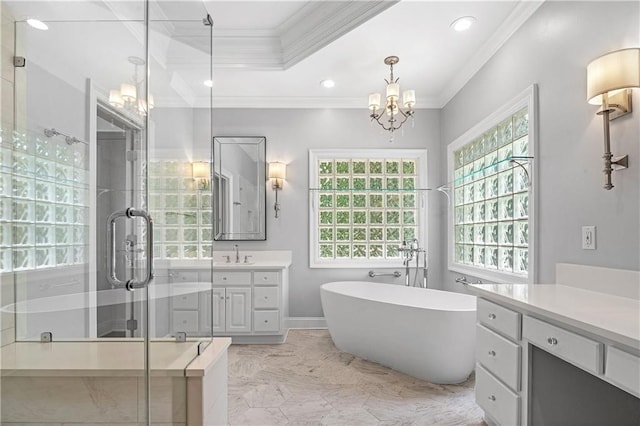 bathroom featuring crown molding, an inviting chandelier, vanity, a tray ceiling, and plus walk in shower