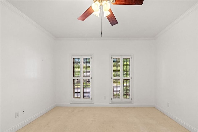 unfurnished room with crown molding, light colored carpet, and ceiling fan