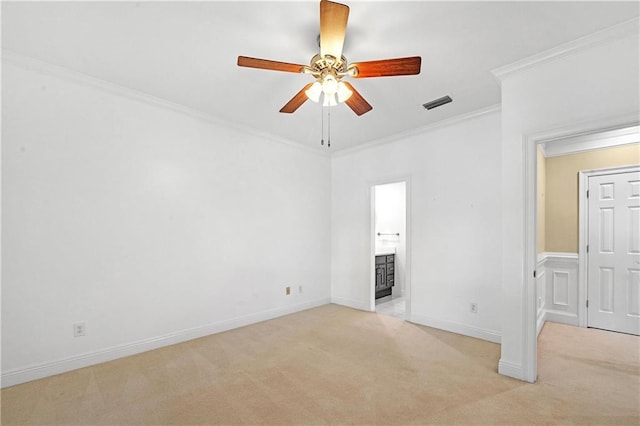 carpeted spare room with crown molding and ceiling fan