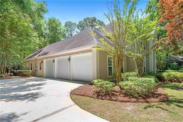 view of side of home with a garage