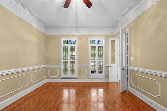 unfurnished room featuring ceiling fan, ornamental molding, and hardwood / wood-style floors