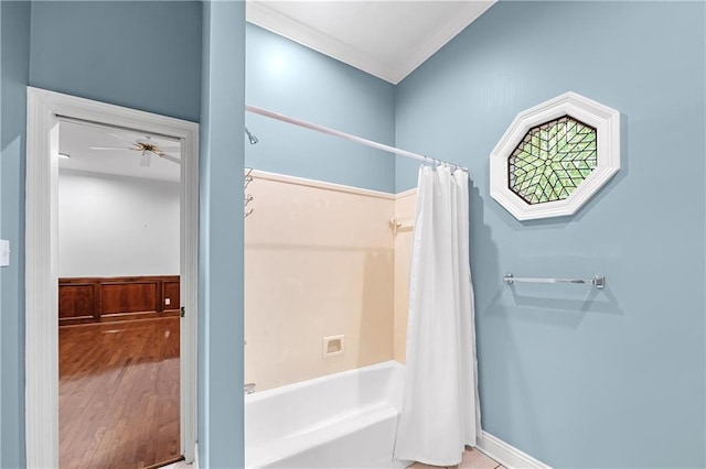 bathroom featuring wood-type flooring, ceiling fan, and shower / bath combo with shower curtain