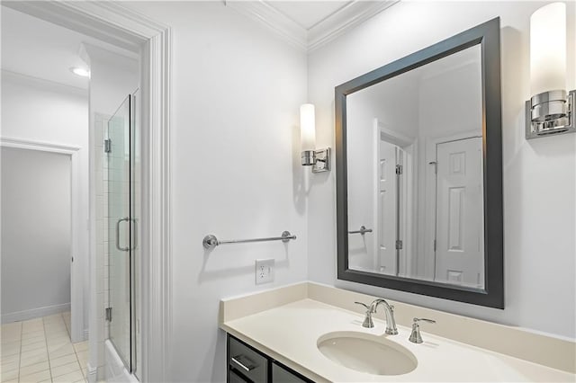 bathroom featuring tile patterned floors, a shower with shower door, ornamental molding, and vanity