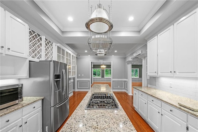 kitchen featuring white cabinets and appliances with stainless steel finishes