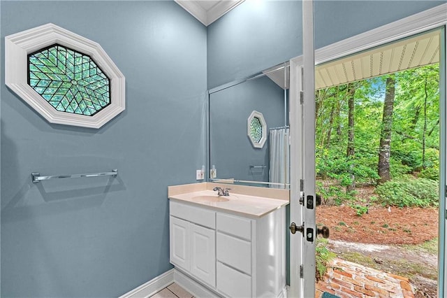 bathroom with vanity and crown molding