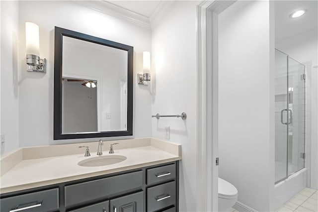 bathroom featuring vanity, crown molding, tile patterned flooring, ceiling fan, and toilet