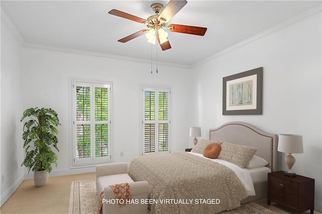 carpeted bedroom with ceiling fan, ornamental molding, and multiple windows