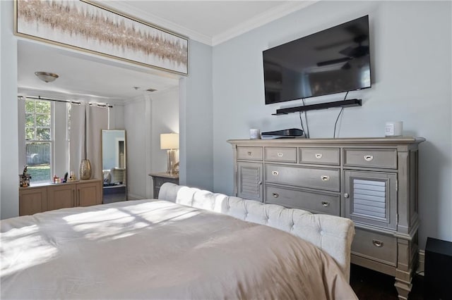 bedroom featuring crown molding