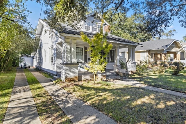 view of front of home with a front lawn and covered porch