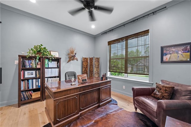 office featuring light wood finished floors, a ceiling fan, baseboards, and recessed lighting