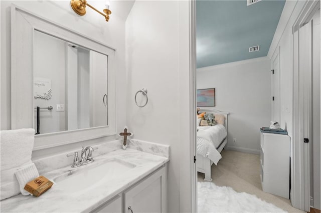 ensuite bathroom featuring vanity