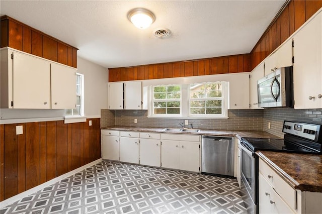 kitchen featuring sink, white cabinets, and appliances with stainless steel finishes