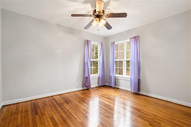 spare room featuring ceiling fan and light hardwood / wood-style flooring