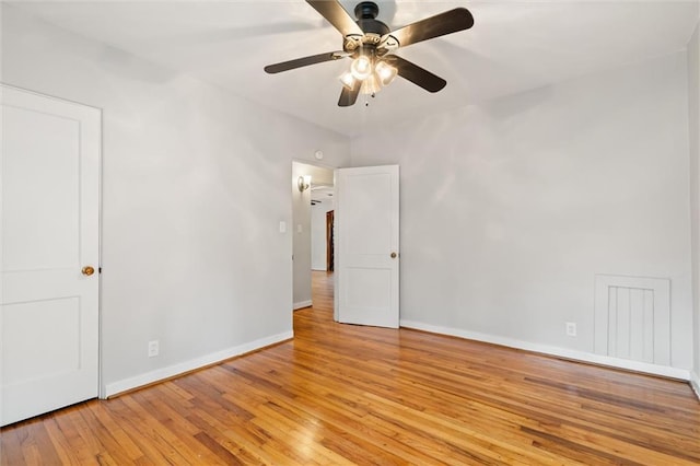 unfurnished room featuring ceiling fan and light hardwood / wood-style floors