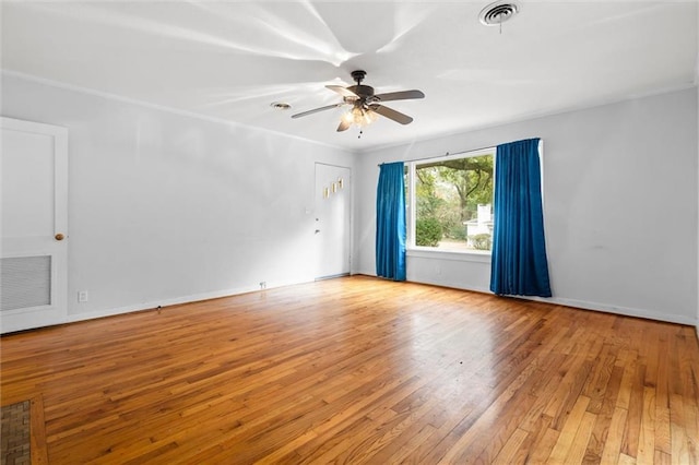 spare room featuring ceiling fan and light wood-type flooring