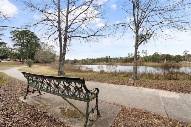 surrounding community featuring a water view