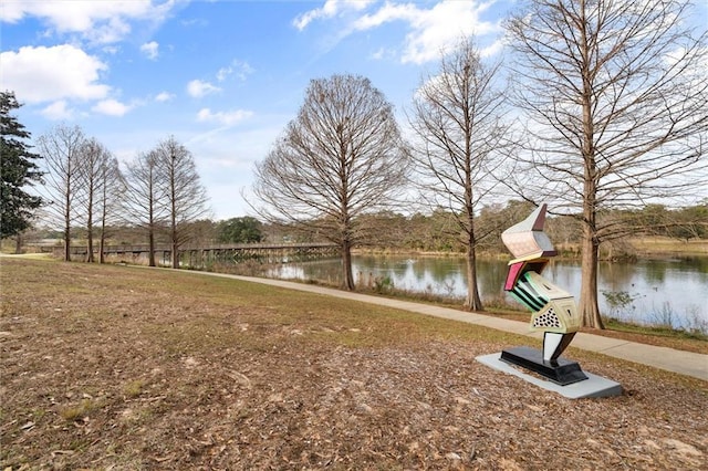 surrounding community featuring a water view