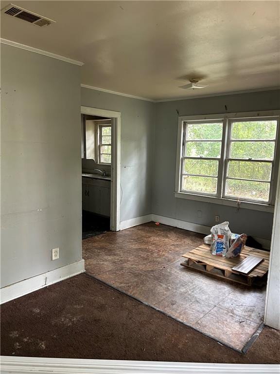 unfurnished room featuring ornamental molding