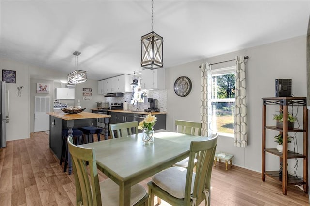 dining room featuring light wood finished floors