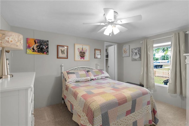 bedroom with ceiling fan and carpet