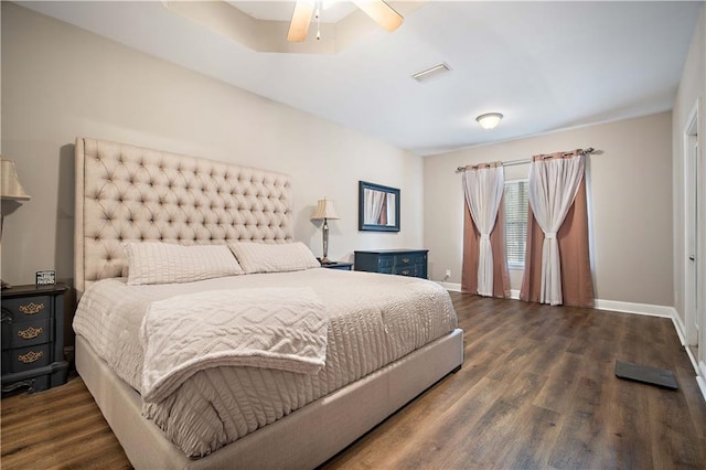 bedroom featuring dark hardwood / wood-style floors and ceiling fan