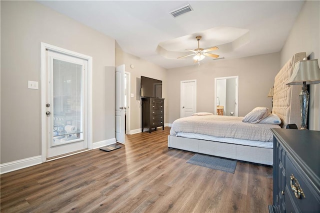 bedroom with ceiling fan and dark hardwood / wood-style flooring