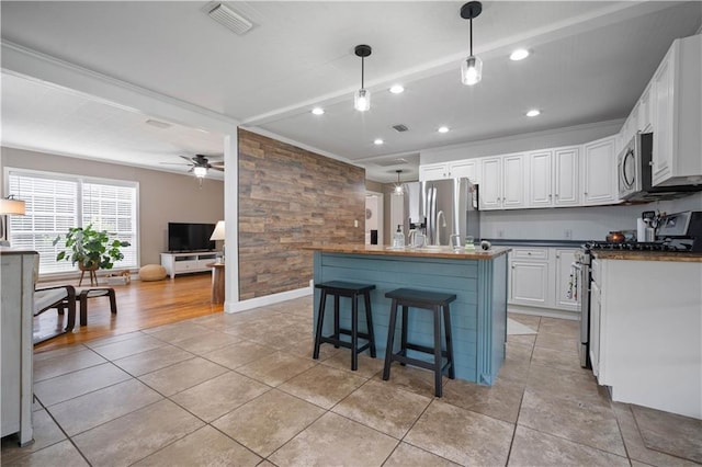 19565 4th St N, Citronelle, AL 36522 - kitchen featuring stainless steel appliances, recessed lighting, white cabinets, ceiling fan, and dark countertops