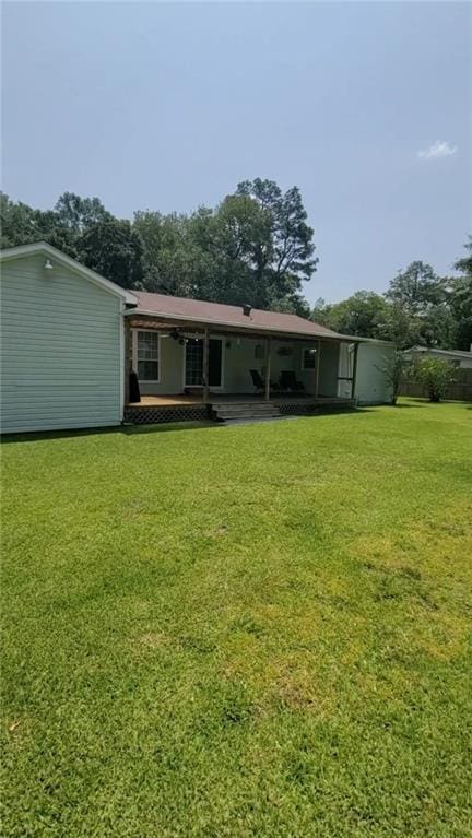 19565 4th St N, Citronelle, AL 36522 - back of house with a yard