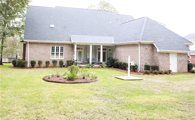 back of house featuring a lawn