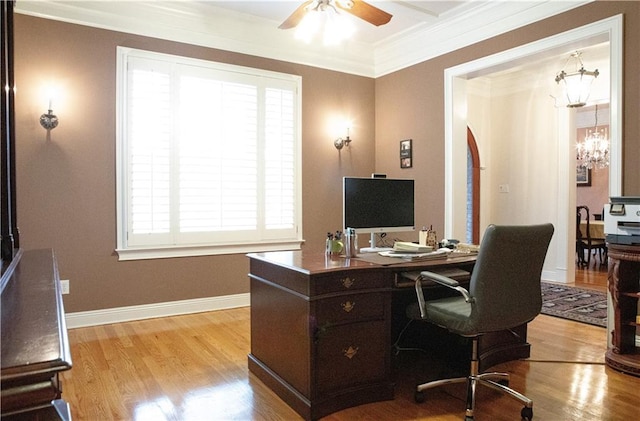 office space with ceiling fan with notable chandelier, ornamental molding, and light hardwood / wood-style floors