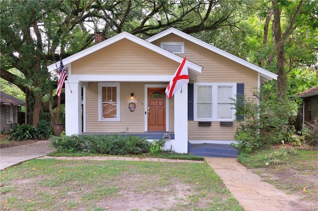 1660 Laurel St, Mobile, AL 36604 - view of front of home featuring a chimney and covered porch