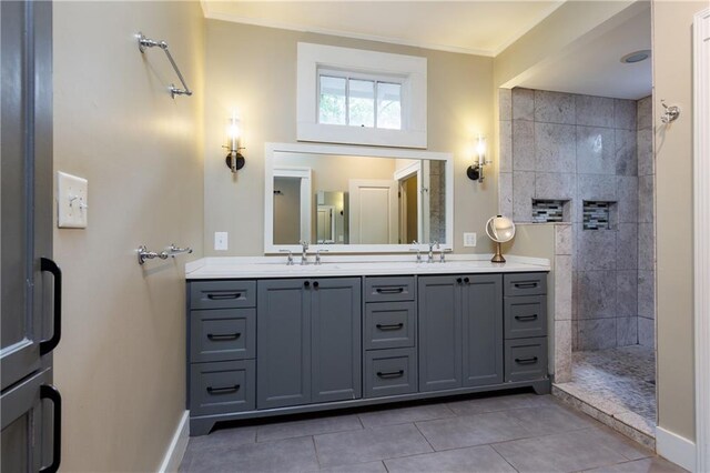 1660 Laurel St, Mobile, AL 36604 - bathroom with double vanity, a walk in shower, baseboards, tile patterned floors, and crown molding