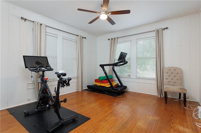 1660 Laurel St, Mobile, AL 36604 - exercise room featuring a decorative wall, ceiling fan, and light wood-style floors