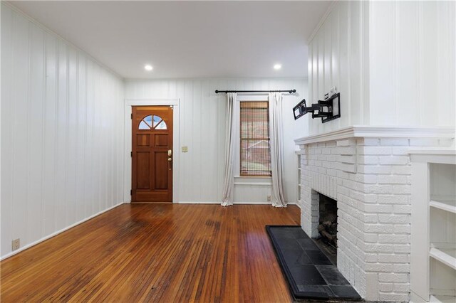 1660 Laurel St, Mobile, AL 36604 - entrance foyer featuring a fireplace and wood finished floors