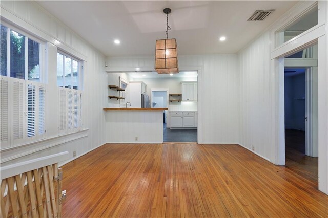 1660 Laurel St, Mobile, AL 36604 - unfurnished living room featuring wood-type flooring and recessed lighting