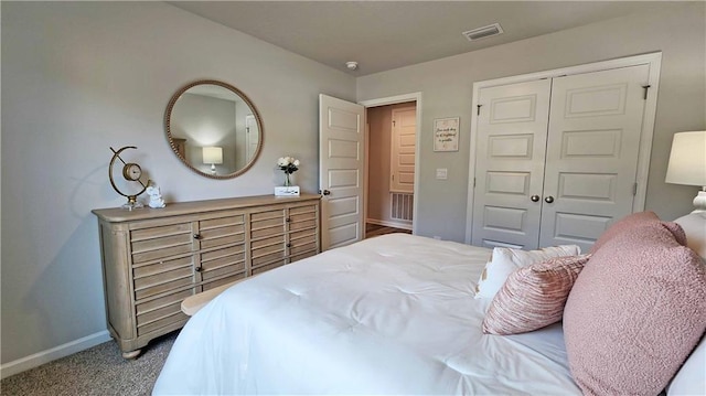8614 Brooklyn Ct, Semmes, AL 36575 - bedroom with baseboards, visible vents, a closet, and carpet