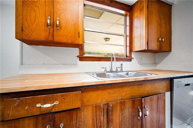 754 Pinemont Dr, Mobile, AL 36609 - kitchen featuring butcher block counters, dishwasher, a sink, and brown cabinetry